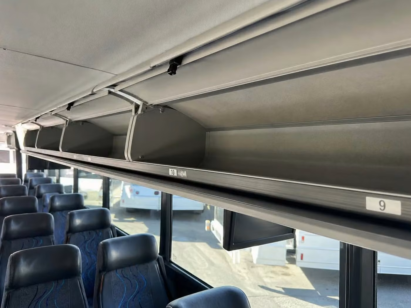 benton 56 passenger charter bus overhead storage